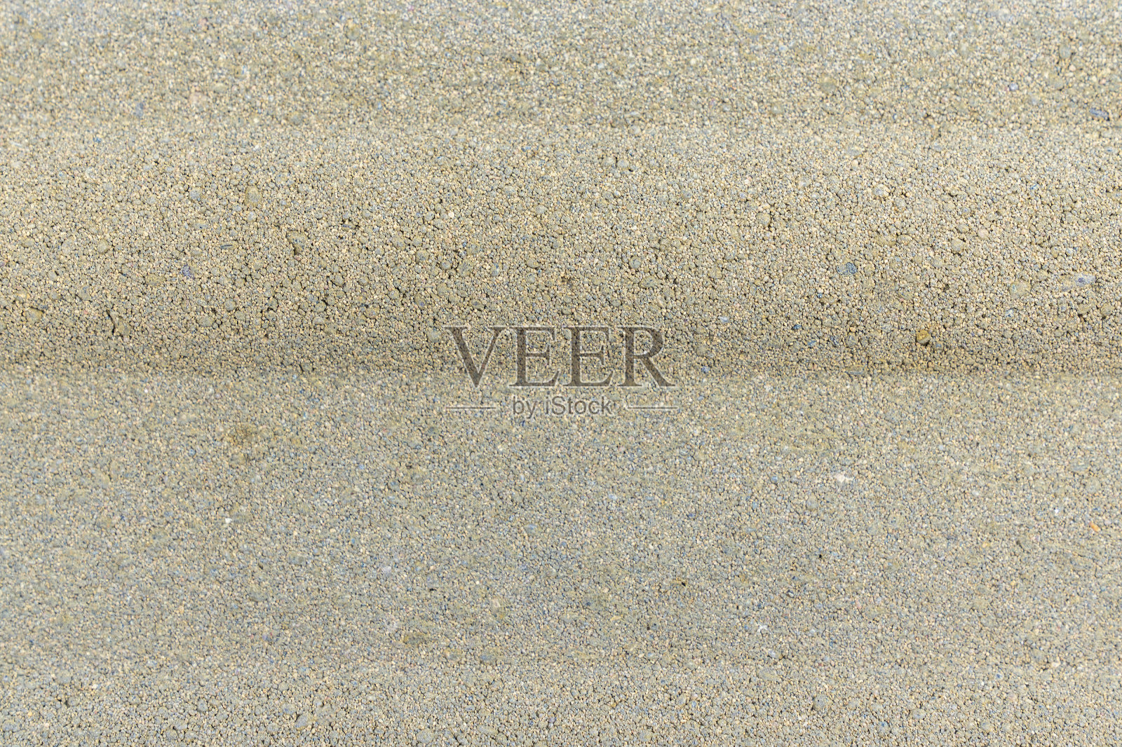 混凝土里的鹅卵石。美丽的石头地板路径。背景和纹理照片摄影图片