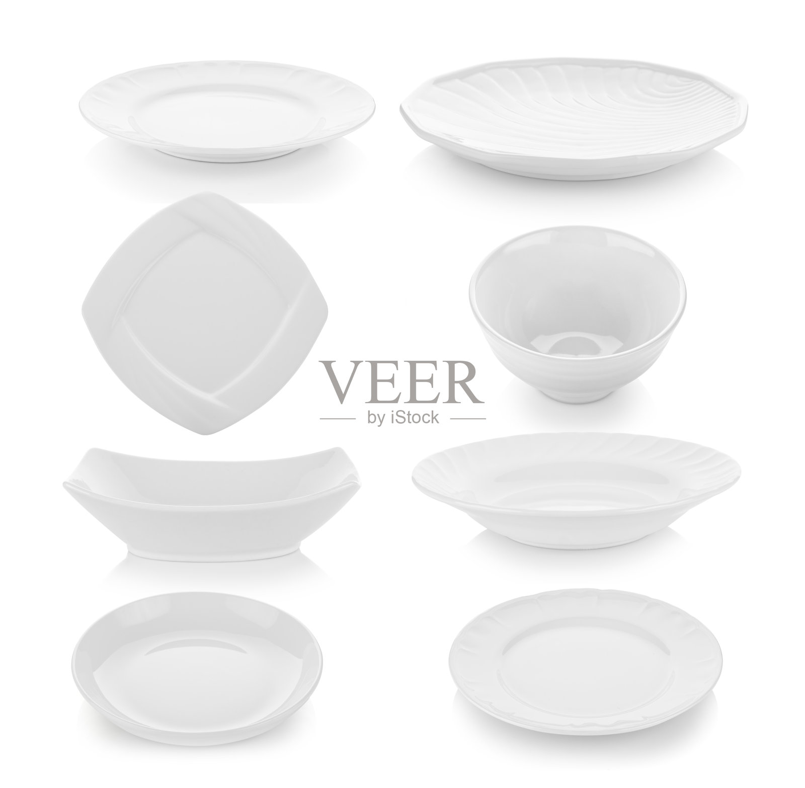 一套盘子和碗在白色的背景照片摄影图片