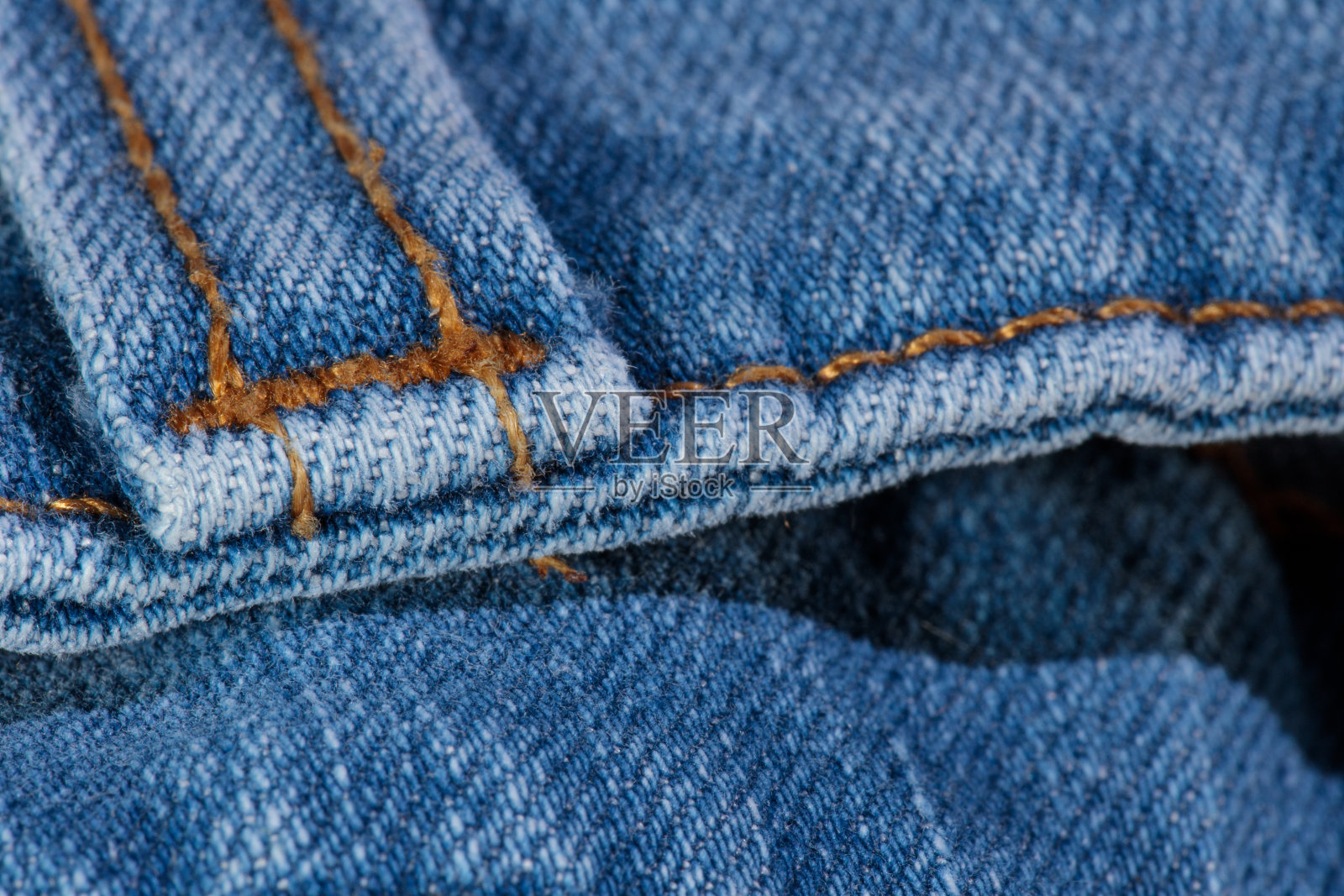 特写腰带环在蓝色牛仔裤照片摄影图片