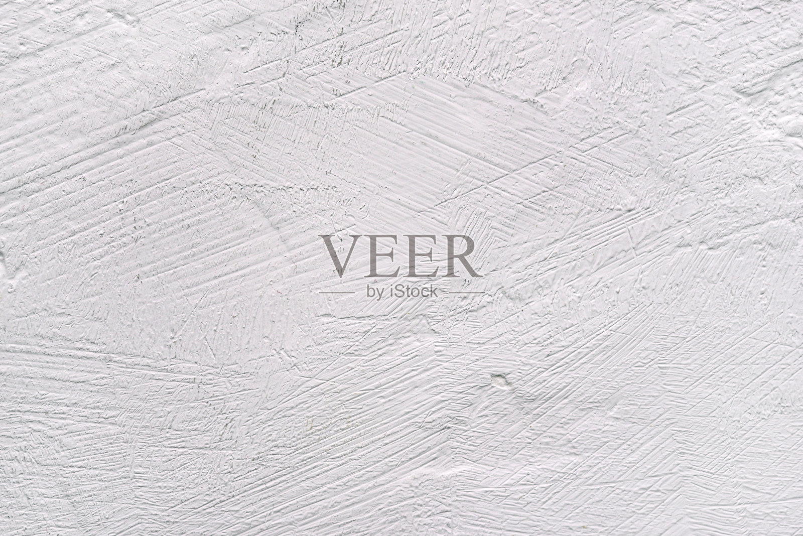 白色背景与纹理表面。灰泥墙或桌子。照片摄影图片