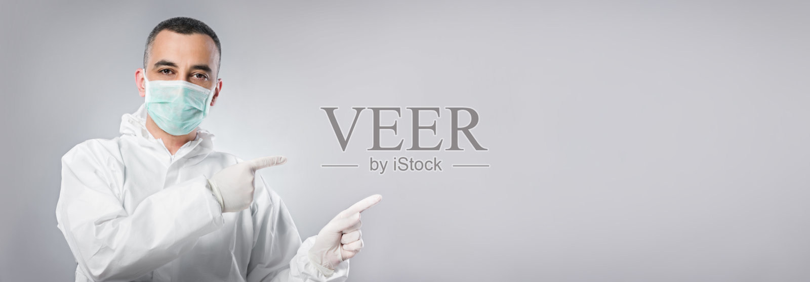 身穿防护服的医生肖像,COVID-19概念照片摄影图片