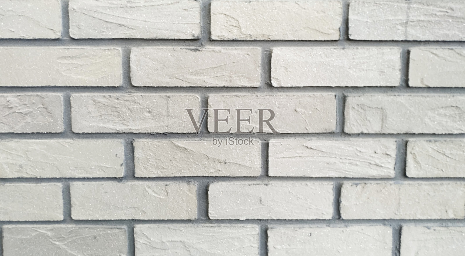 建筑背景或灰绿色抽象风格背景的砖墙。照片摄影图片