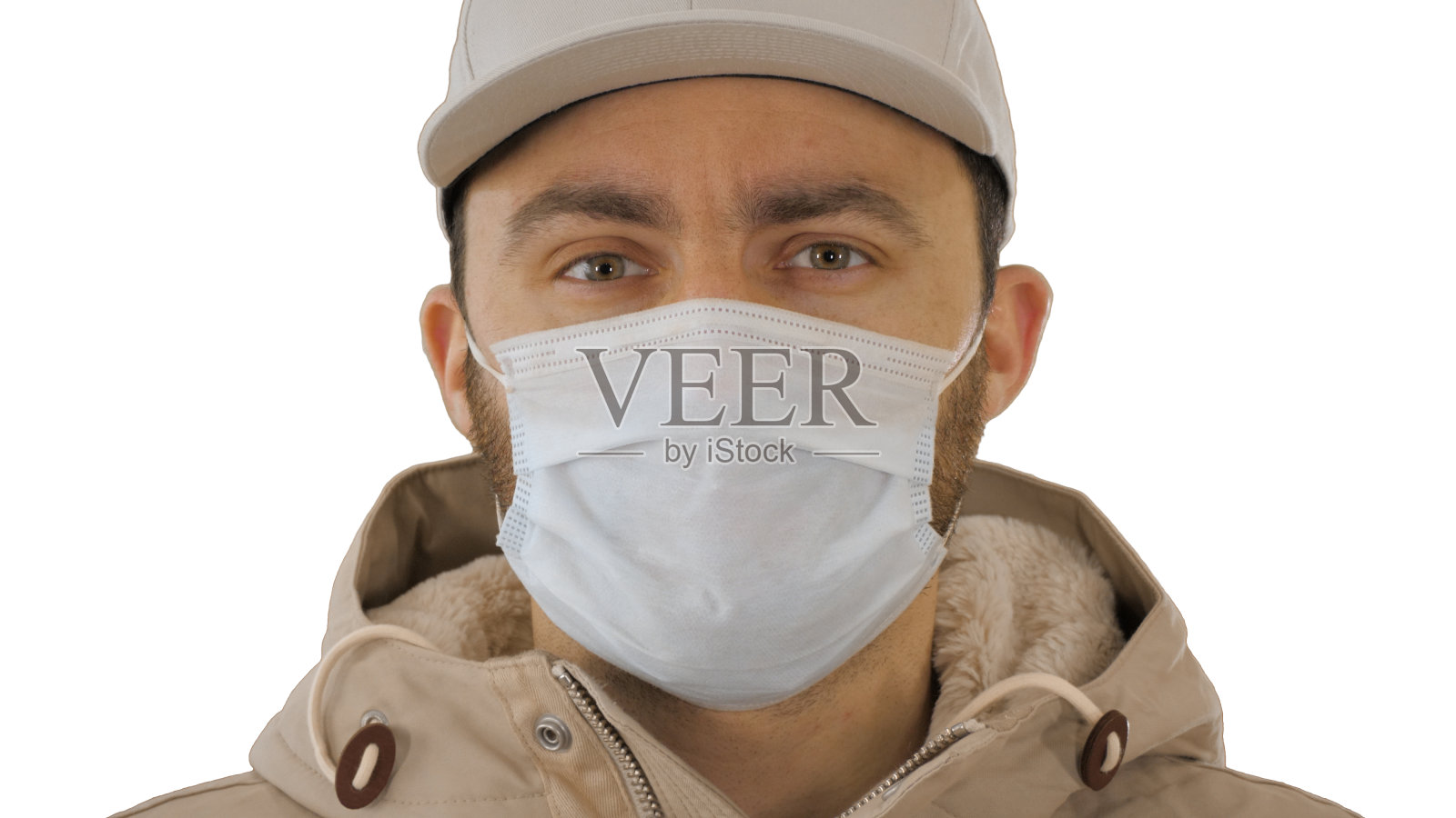 生病的年轻人英俊的戴着医用口罩在白色的背景照片摄影图片