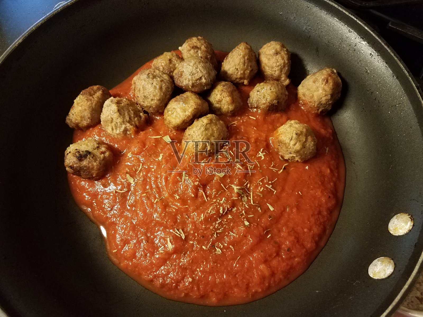 蕃茄酱牛肉丸子煎锅照片摄影图片