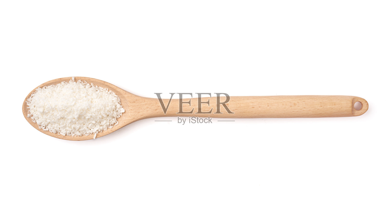 木勺上放椰子片照片摄影图片