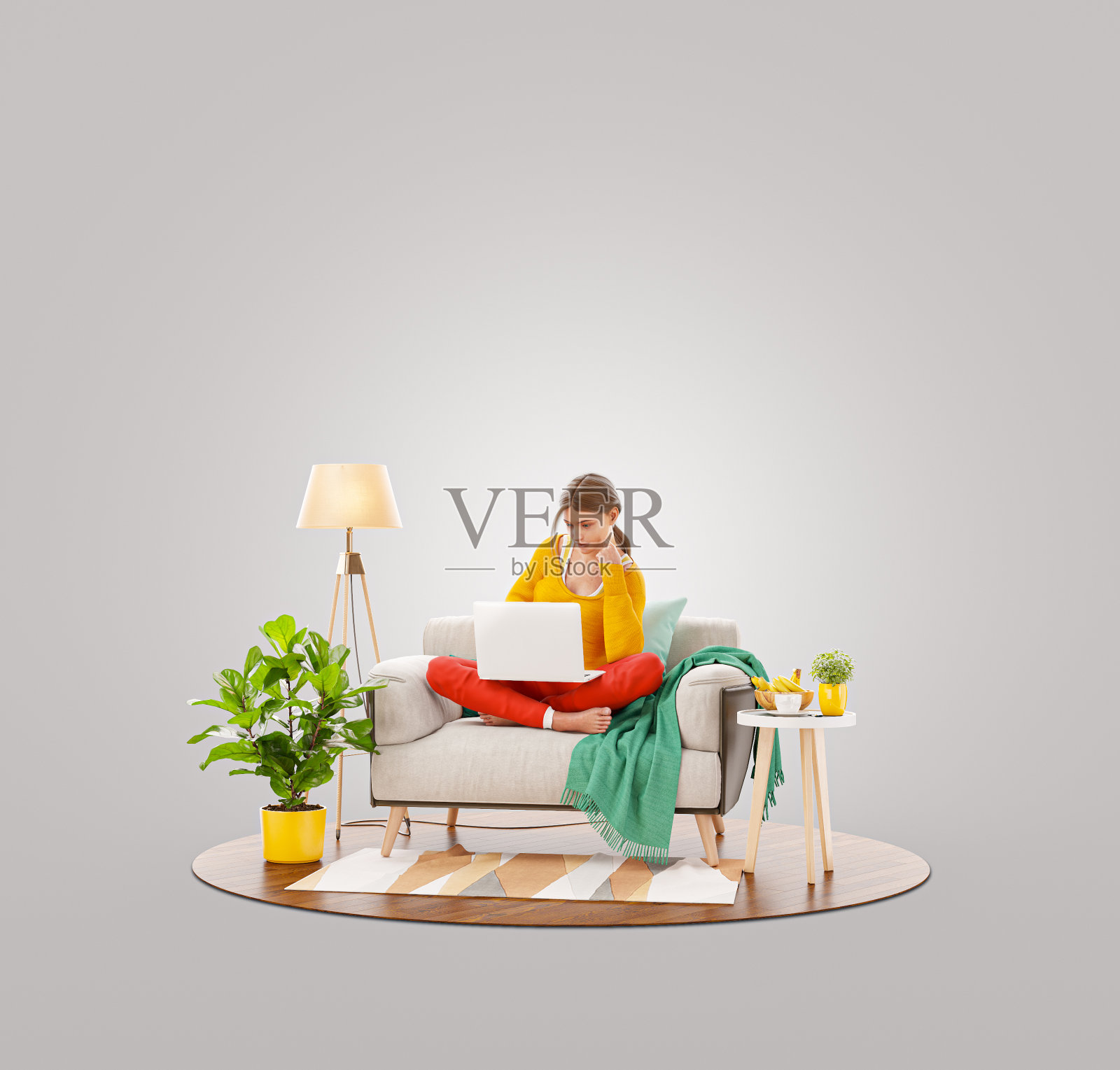 年轻漂亮的女性坐在家庭办公室的沙发上用笔记本电脑工作。照片摄影图片