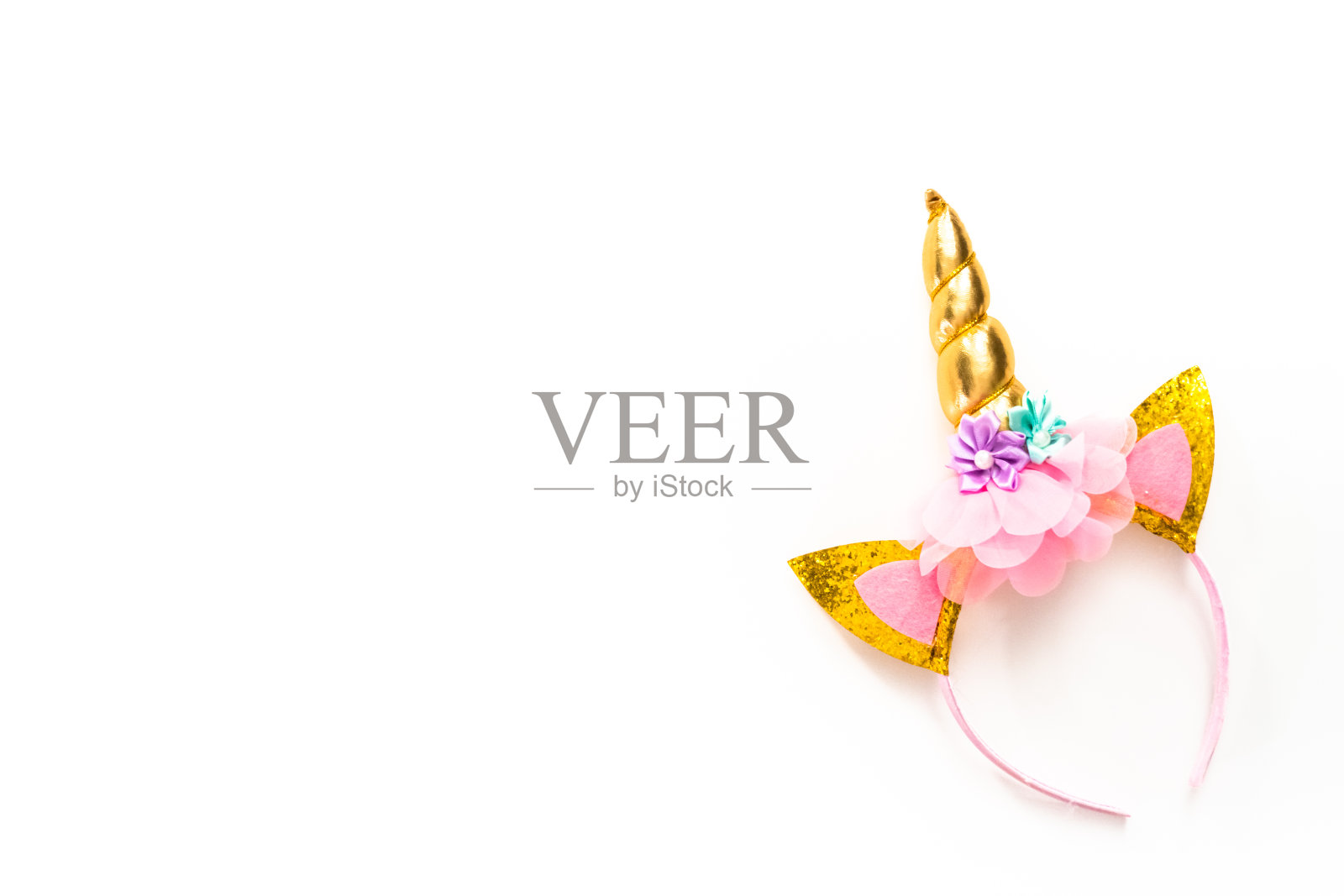 彩色独角兽头带上的白色背景。照片摄影图片