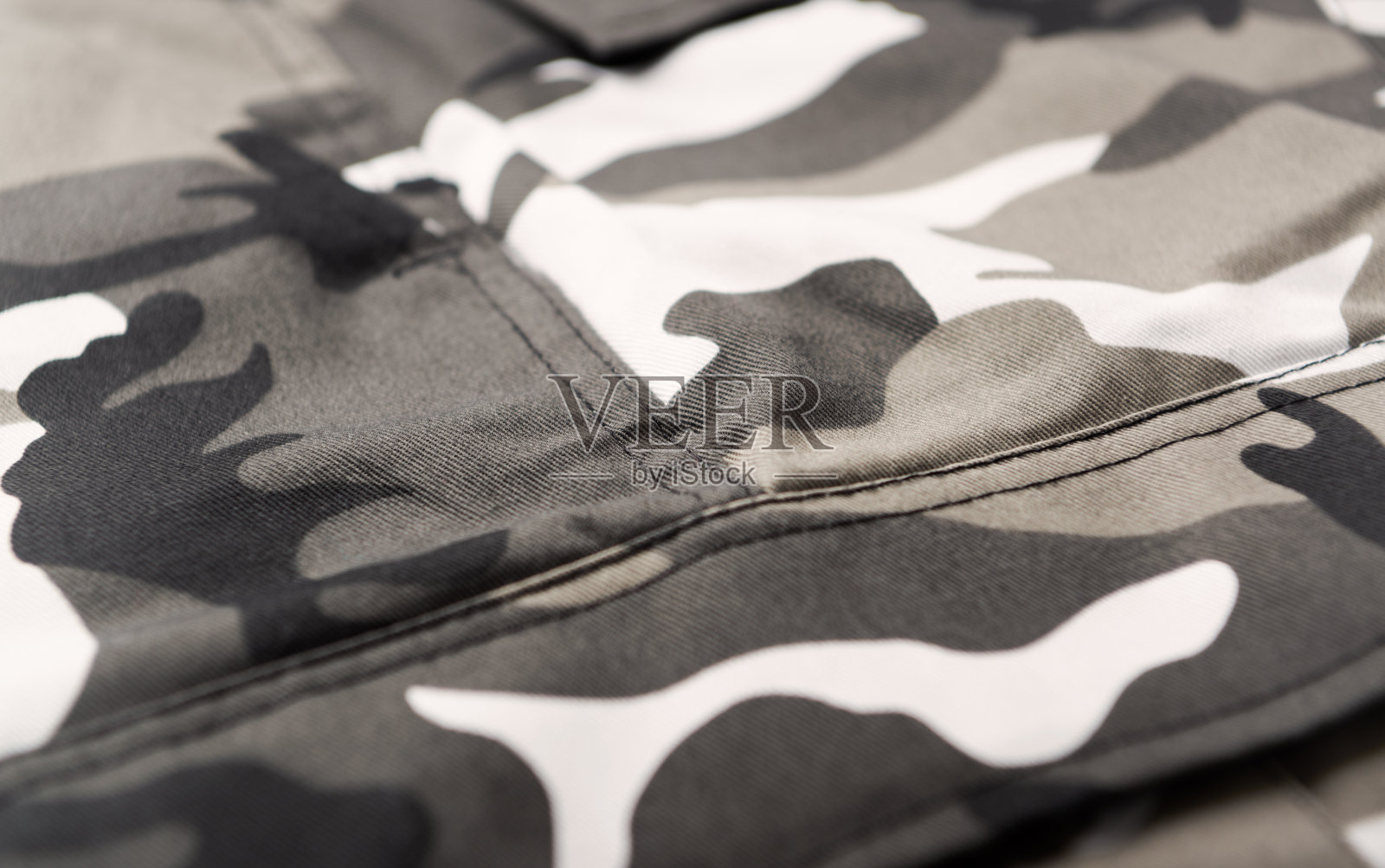 有迷彩图案的裤子。关闭了。照片摄影图片