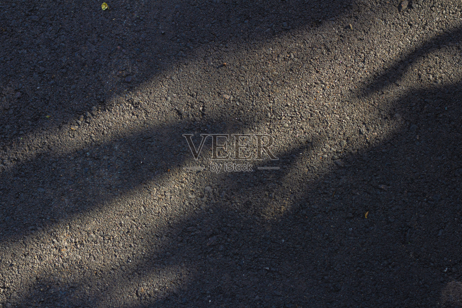 粗糙的沥青纹理与阴影照片摄影图片