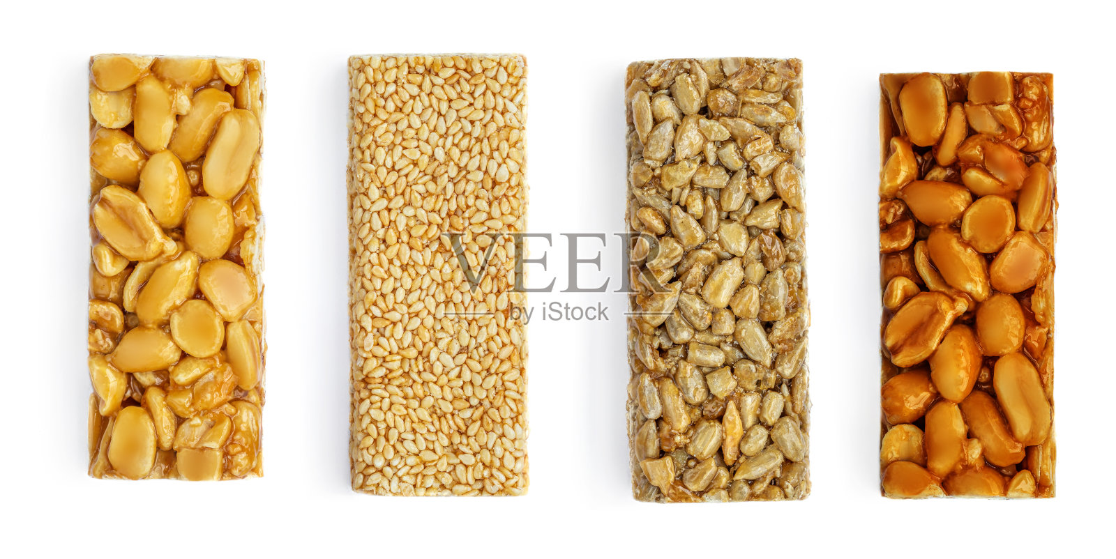 各种格兰诺拉坚果棒孤立在白色背景。健康能量棒与花生,芝麻和焦糖照片摄影图片