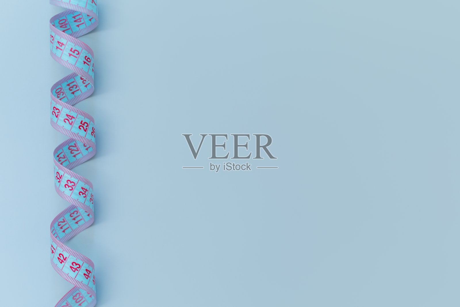 带拷贝空间的蓝色背景卷尺照片摄影图片