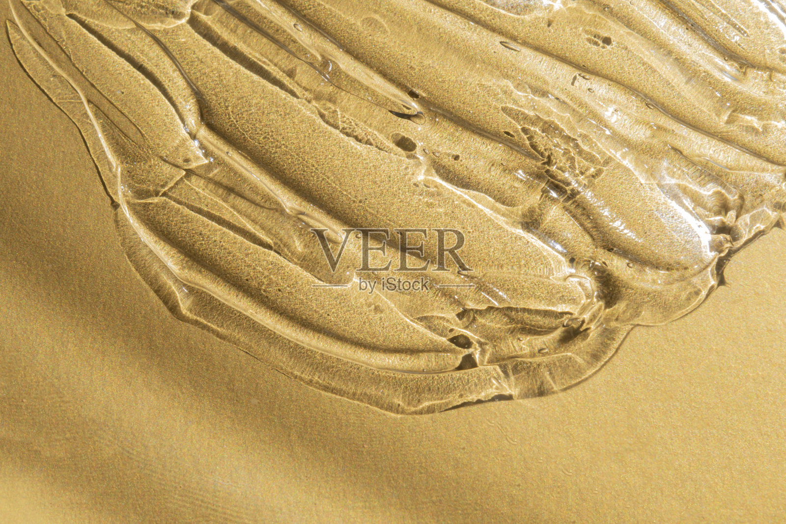 透明凝胶纹理上的黄金金属背景照片摄影图片