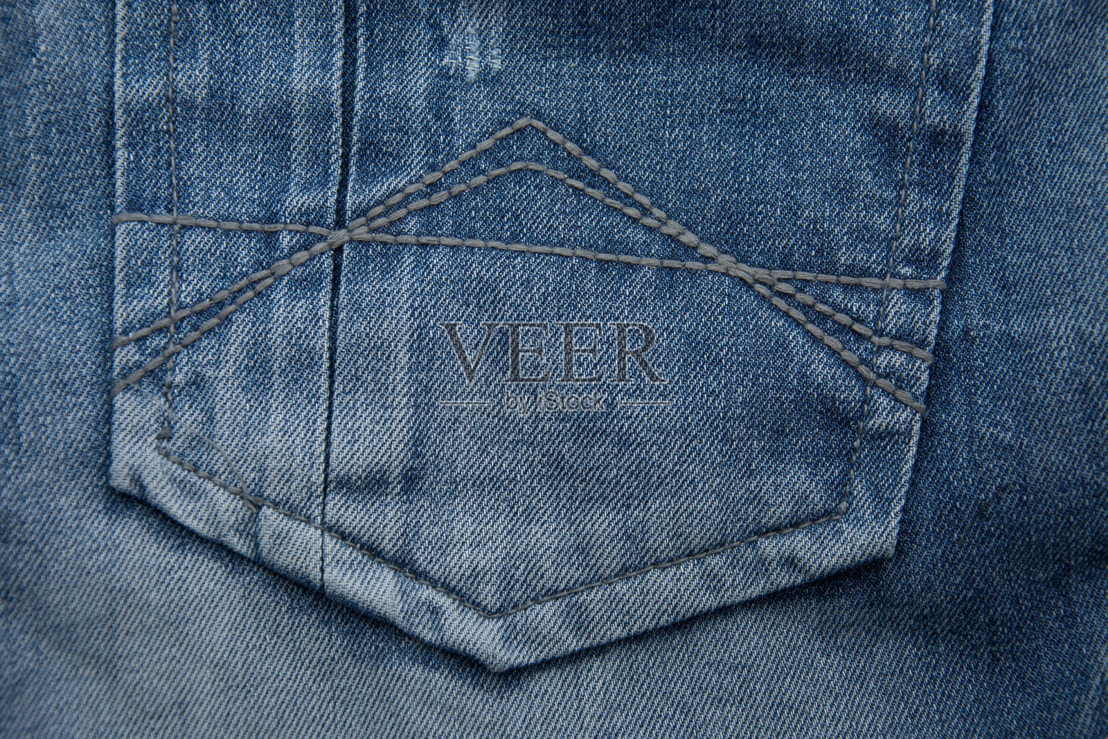 旧牛仔裤的口袋里照片摄影图片