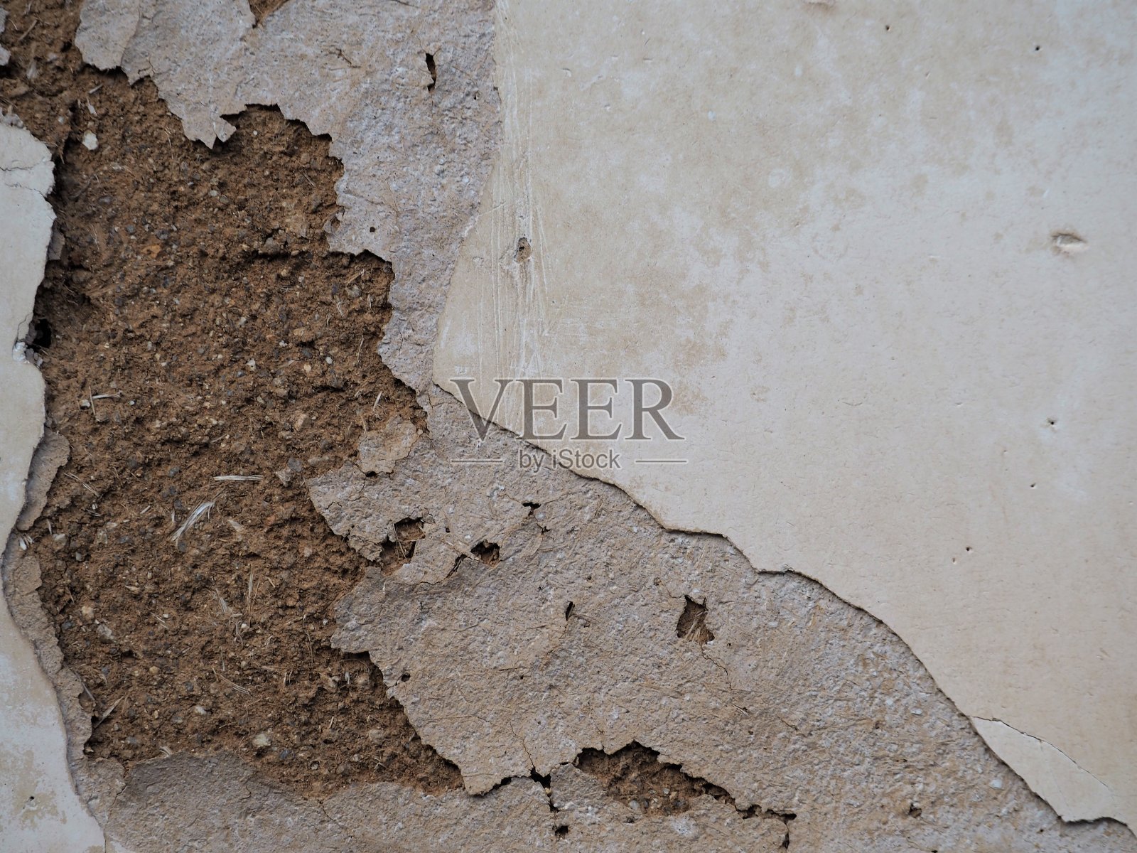 近距离观察传统日本房屋的开裂的土墙表面照片摄影图片