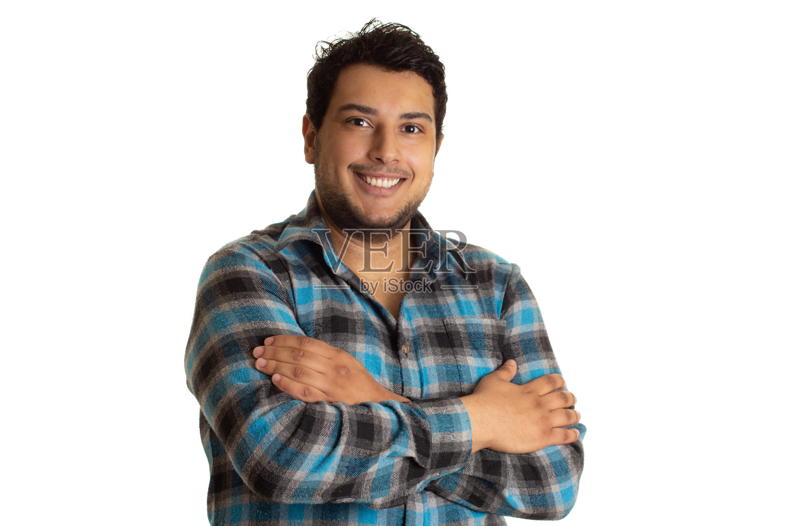 那家伙在摆姿势拍照,双臂交叉,笑容可掬照片摄影图片