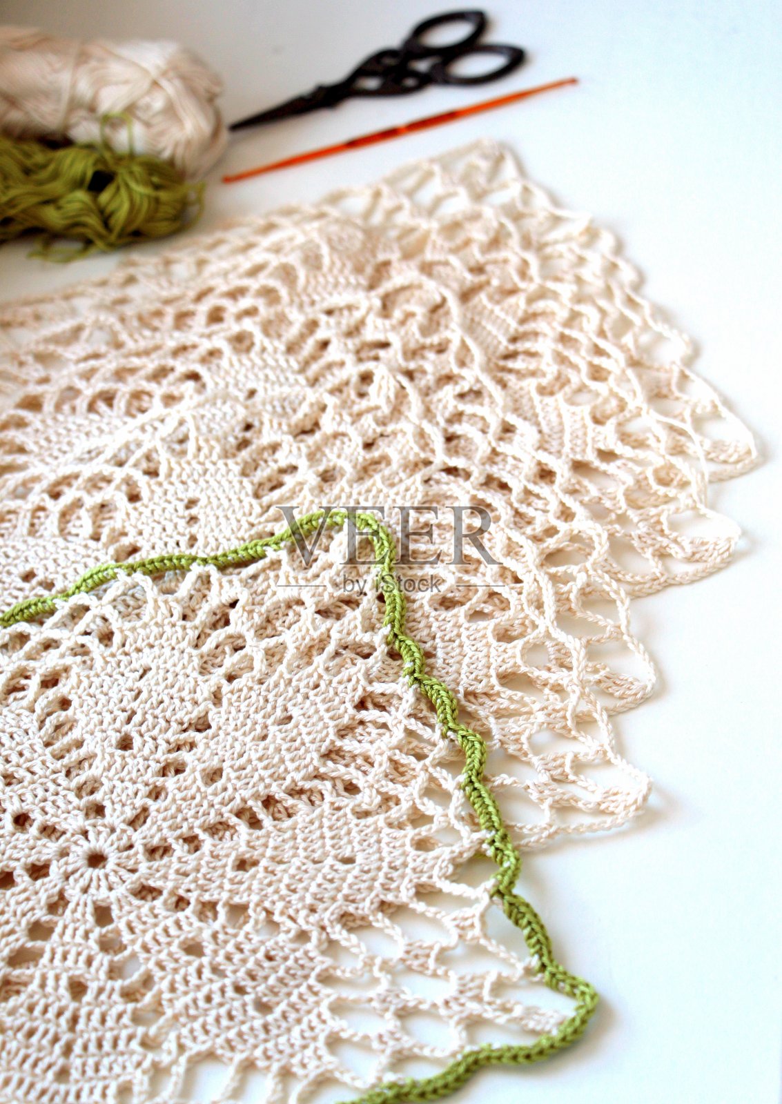 米色图案由棉和粘胶纱钩织而成。照片摄影图片