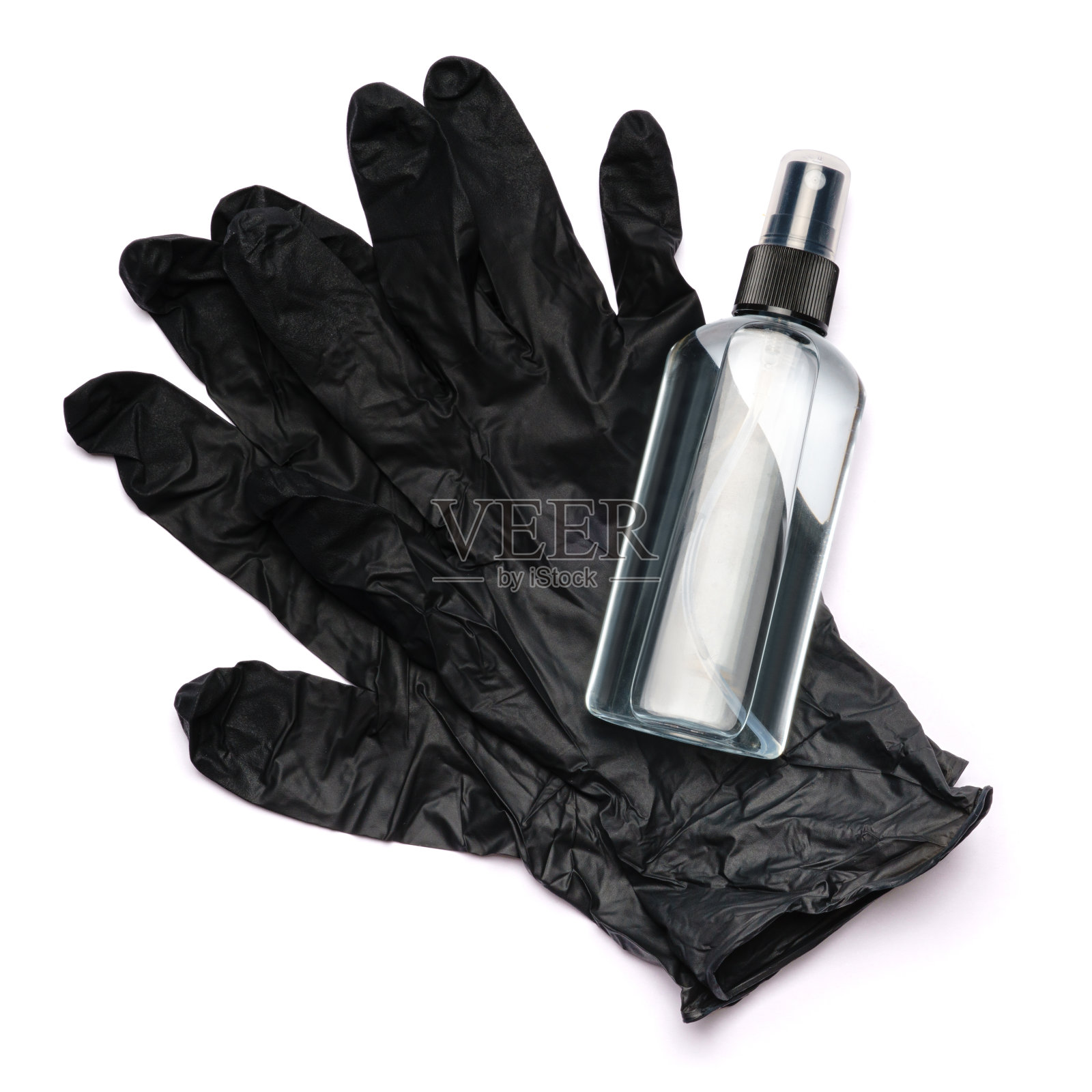 从上往下看,消毒液瓶盖在防护橡胶乳胶一次性手套上照片摄影图片