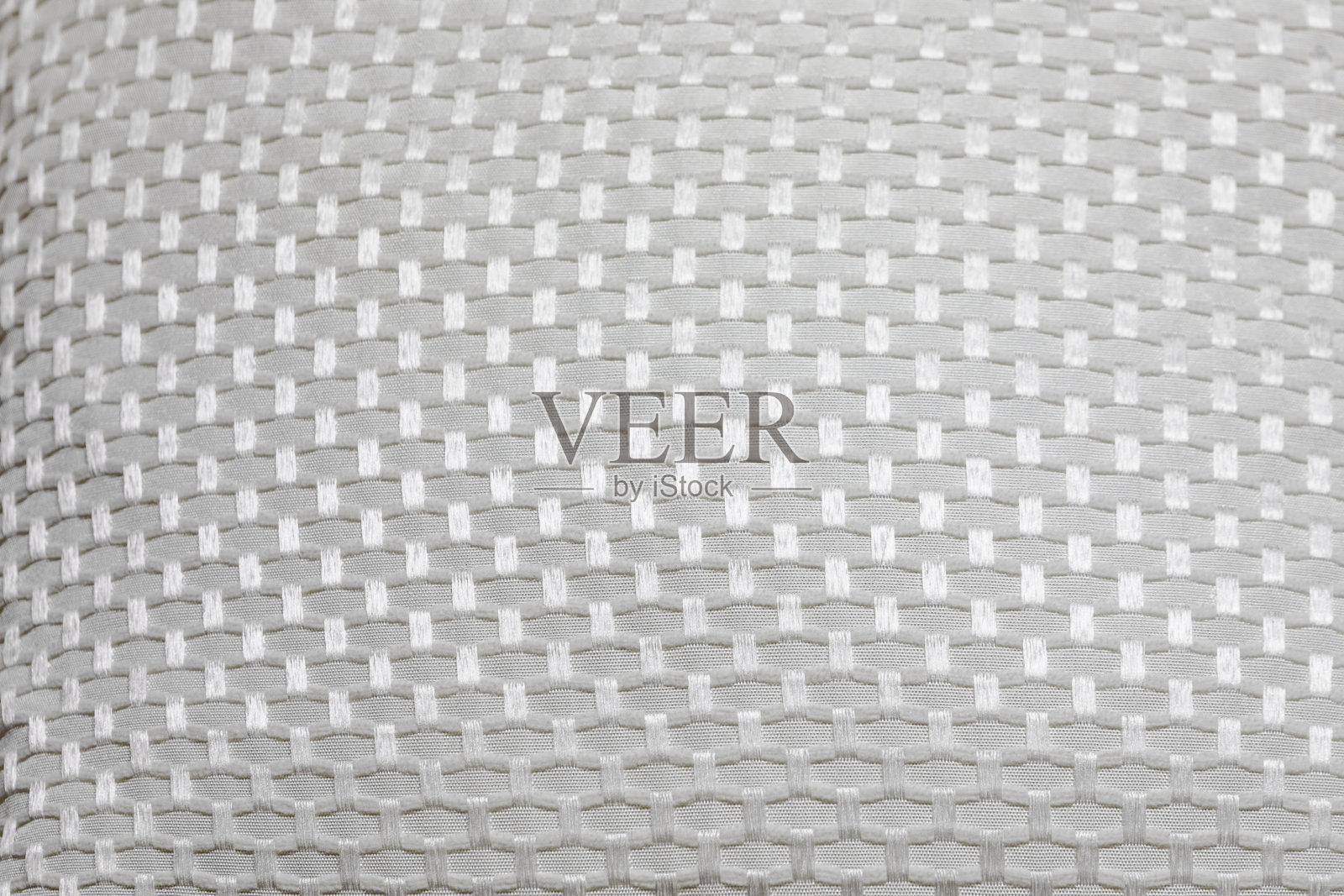 白色的手工枕头。纺织品表面。家庭室内装饰。照片摄影图片