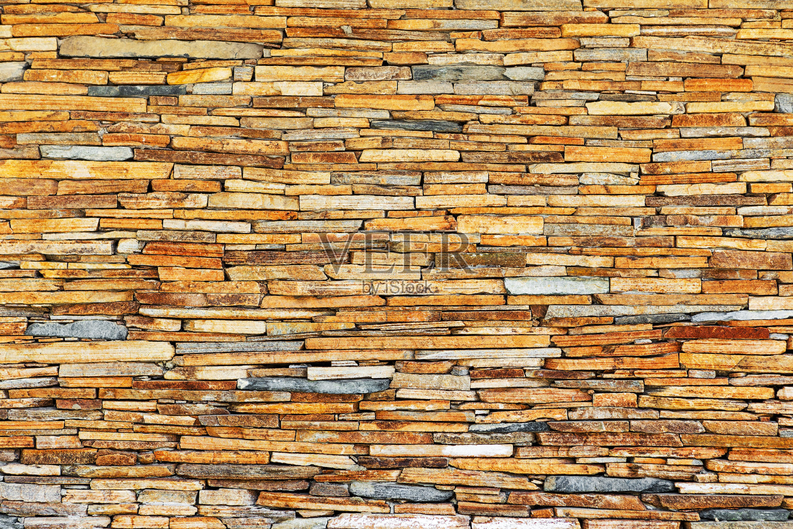 天然石头砌成的墙。可以用作背景。很棒的背景或纹理。照片摄影图片