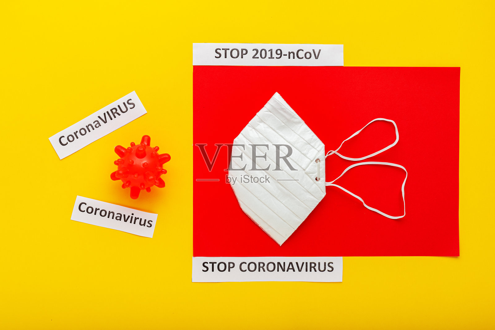 冠状病毒模型,防护口罩,文字STOP 2019 nCoV,停止冠状病毒,黄色,红色背景。COVID-19, COVID-19,冠状病毒爆发和冠状病毒流感。照片摄影图片