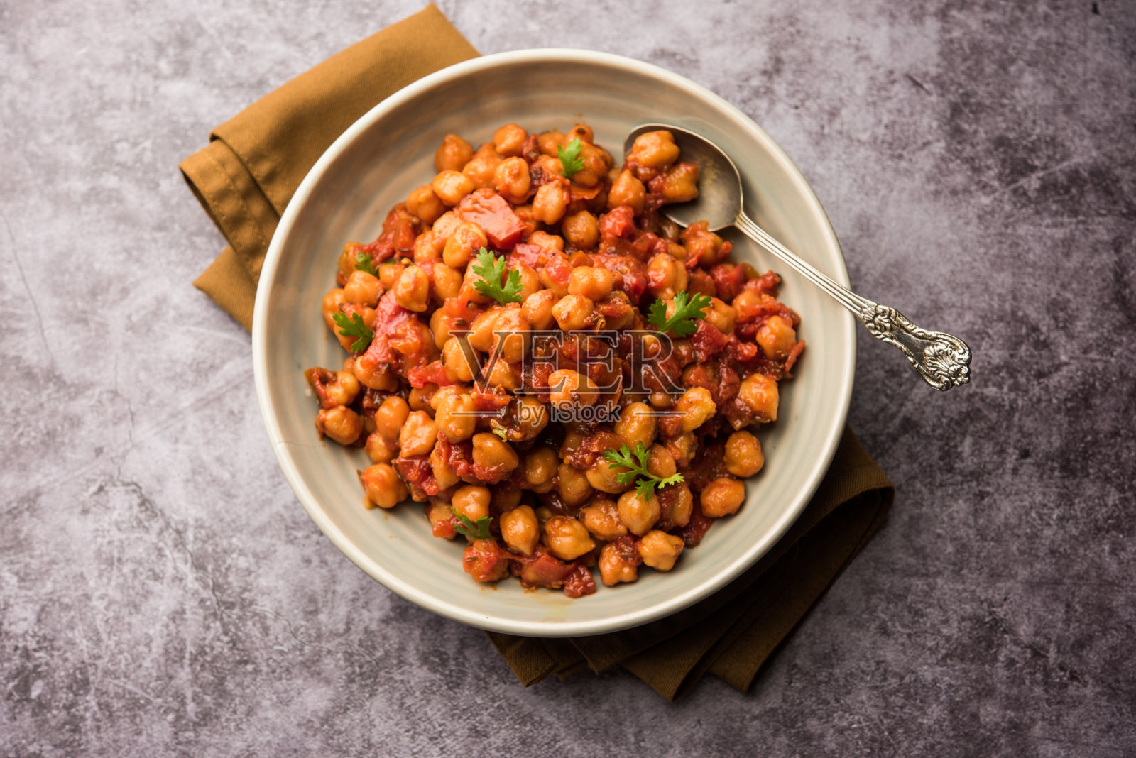 Chana Masala,鹰嘴豆咖喱或Choley。印度的传统食品照片摄影图片