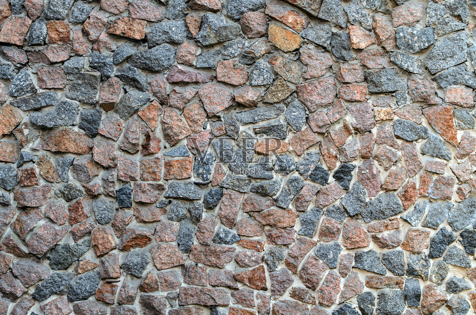 背景,栅栏用石子砌筑照片摄影图片