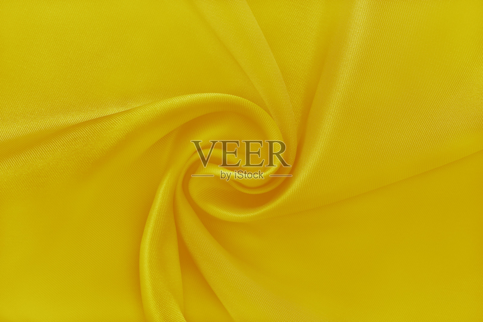 面料金黄金黄,布料质地为背景和设计艺术作品,美丽的褶皱图案的丝绸或亚麻。照片摄影图片