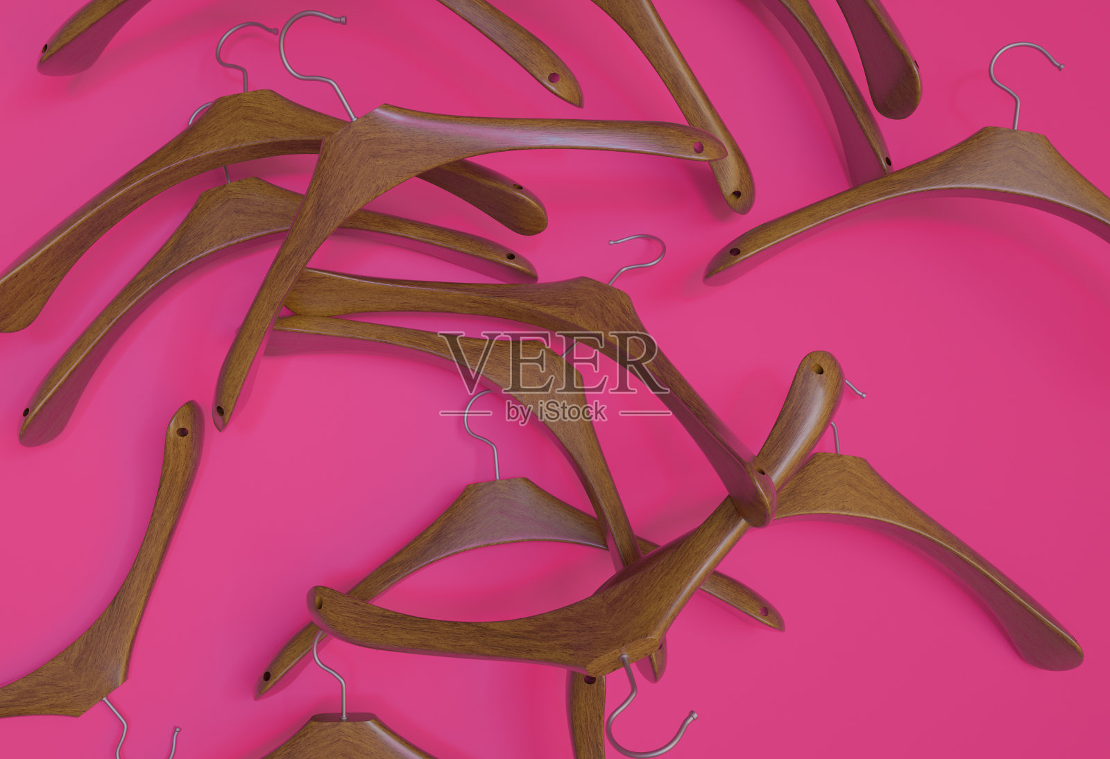 粉色地板上的许多木制衣架,3d渲染照片摄影图片