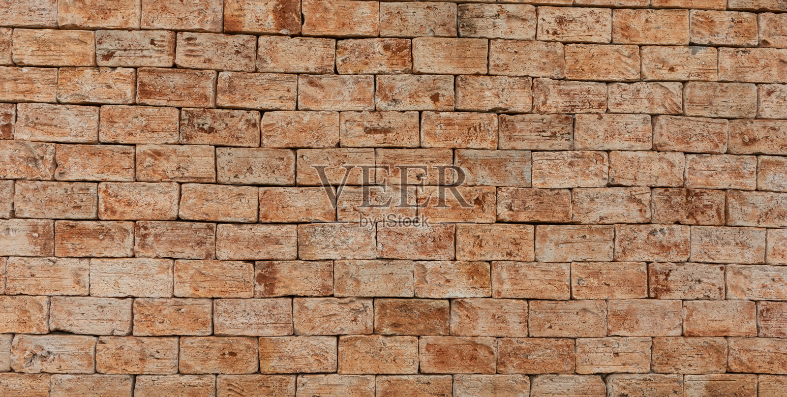 外露砖墙或墙面,带有明显的灰浆。纹理的背景照片摄影图片