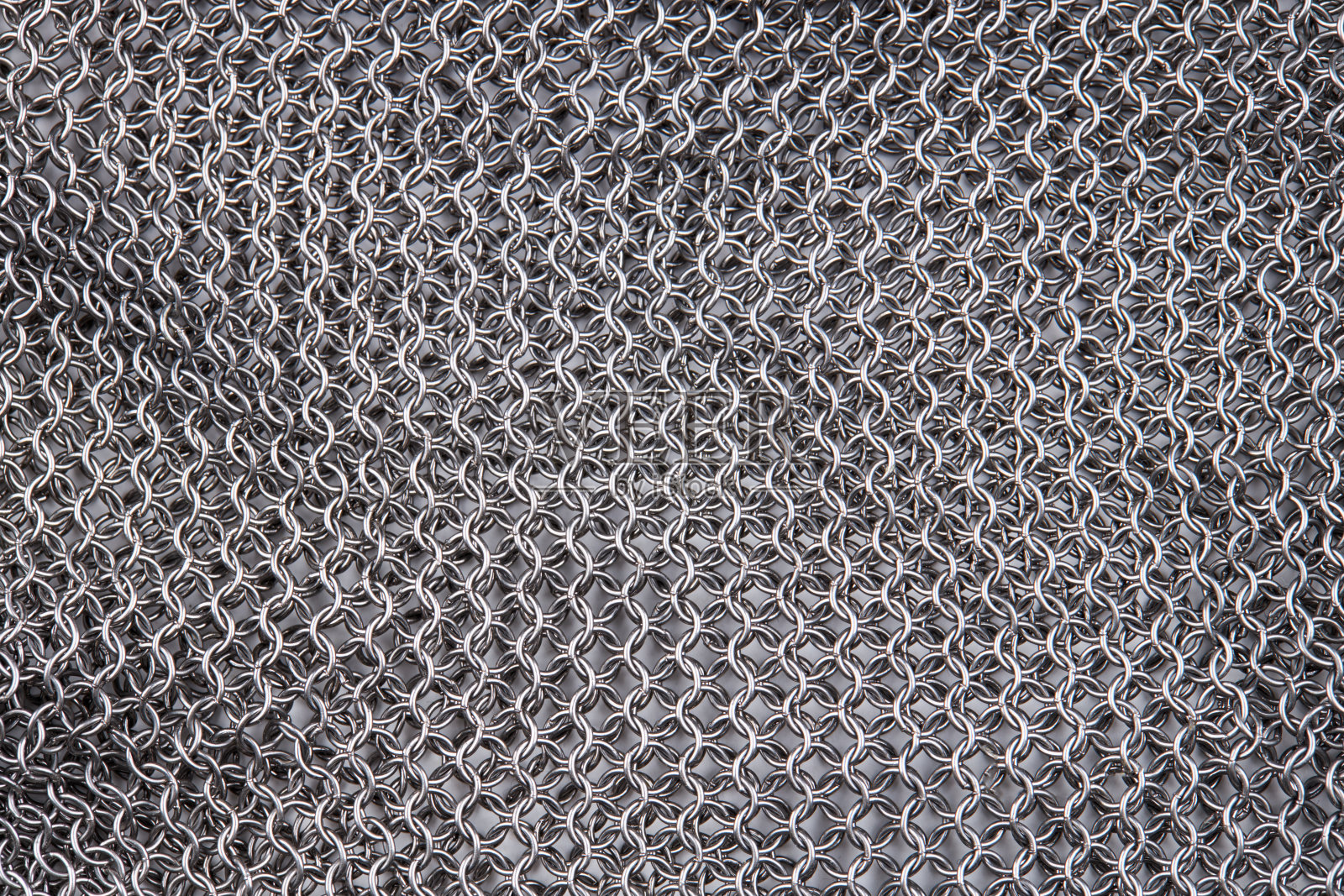 链甲关闭纹理背景。抽象的铁环背景。保护的概念照片摄影图片