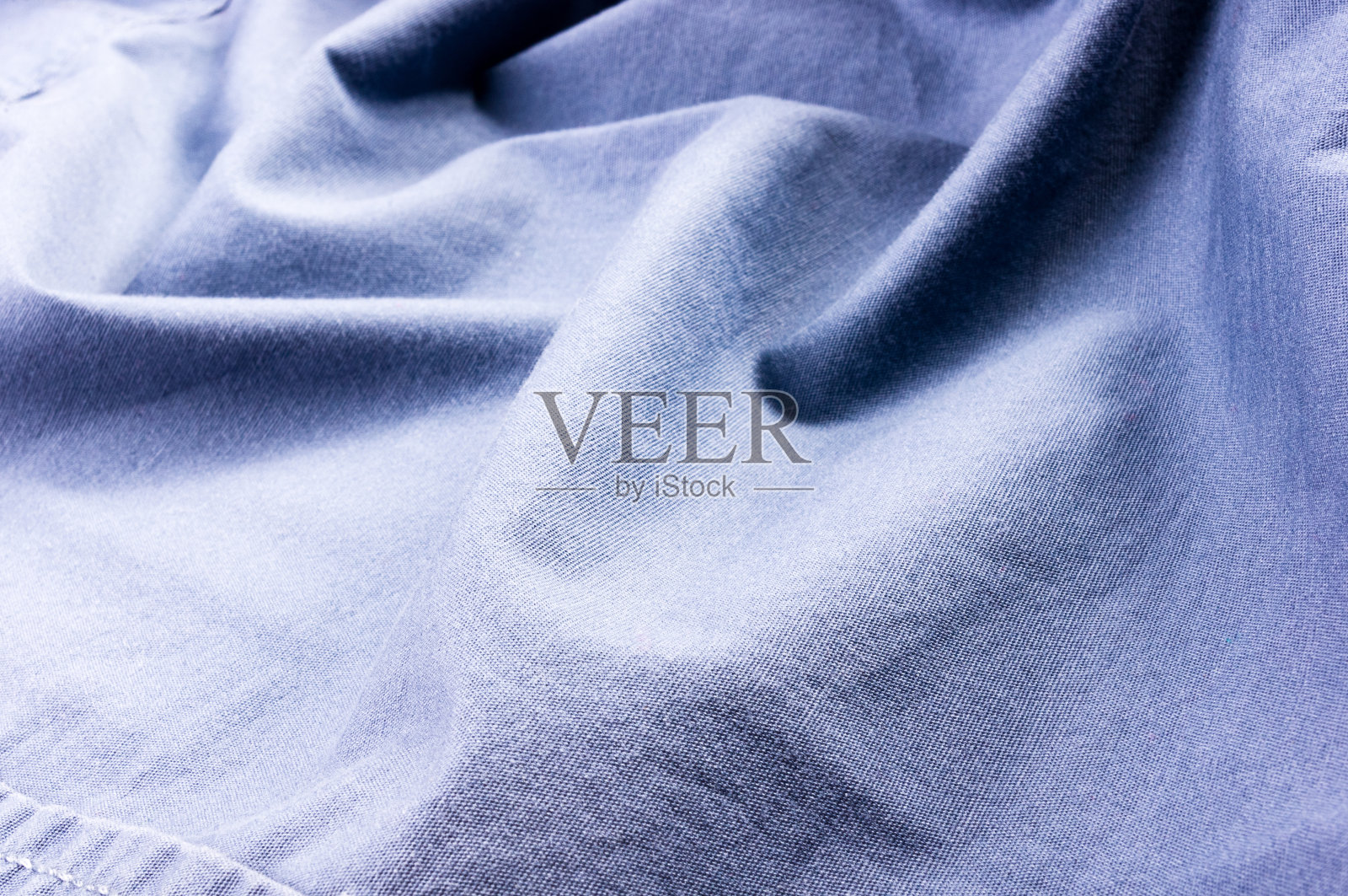 衣服项目石洗棉织物纹理接缝,扣,钮扣和铆钉,宏观照片摄影图片