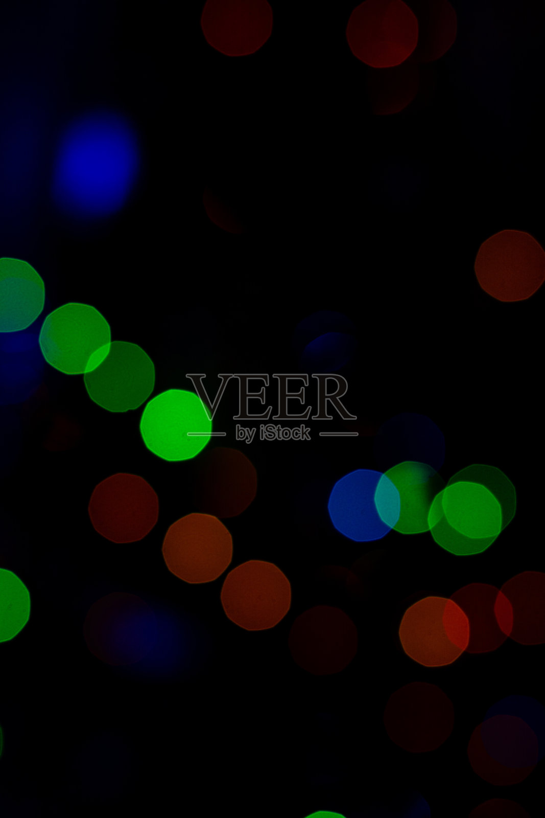 散景的彩色圆形圣诞彩灯。照片摄影图片