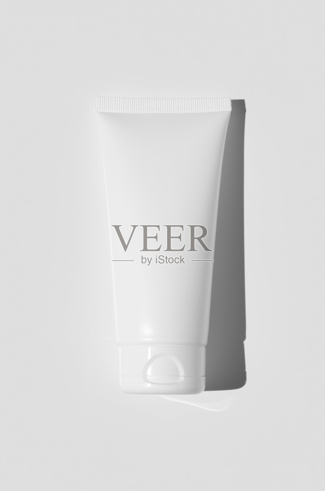 白色奶油管模型。硬阴影。照片摄影图片