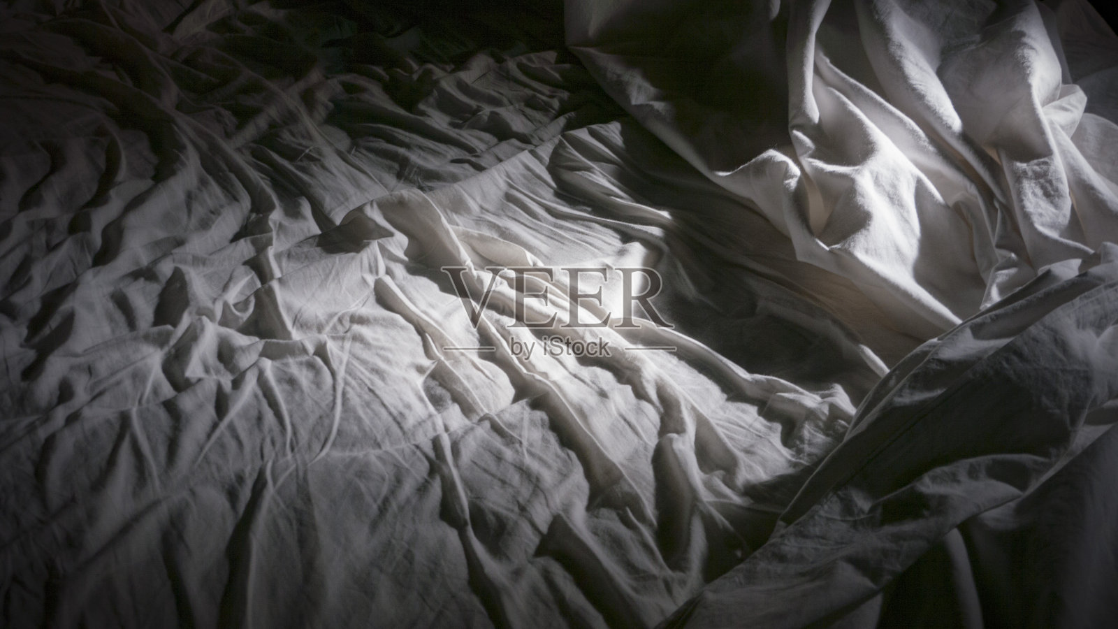 白色床单的床照片摄影图片