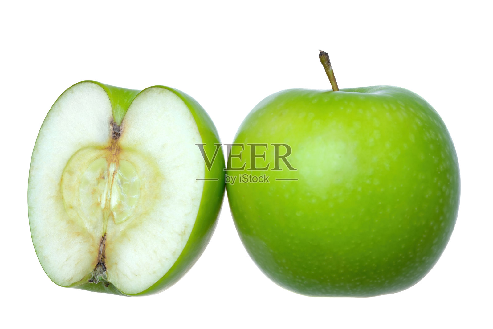 一个新鲜的青苹果,另一半在白色的背景下照片摄影图片