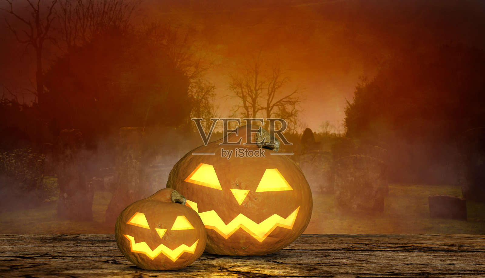 可怕的万圣节背景与咧嘴笑的南瓜和墓碑的背景照片摄影图片