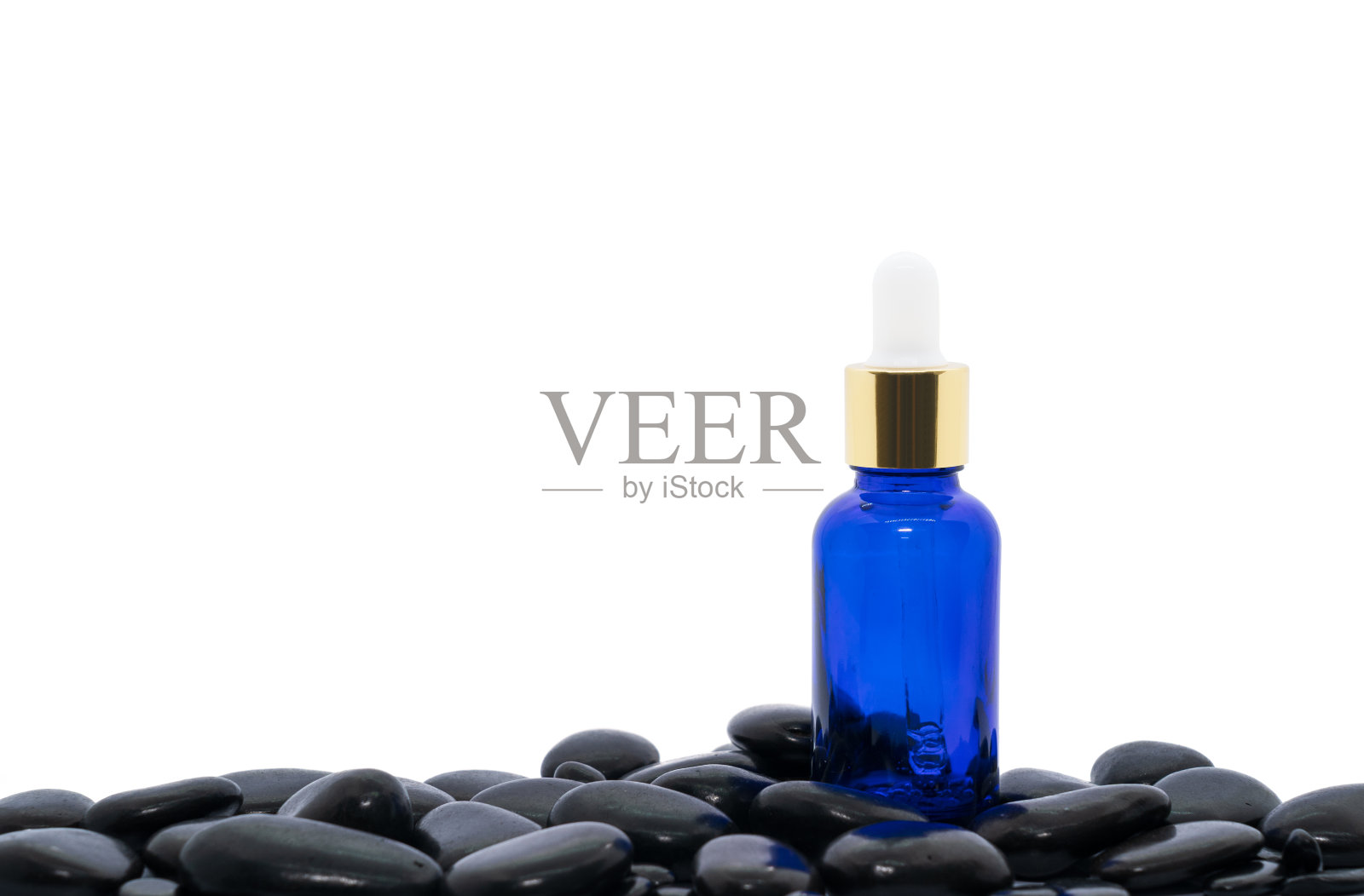 含黑石精油的精华油滴管照片摄影图片