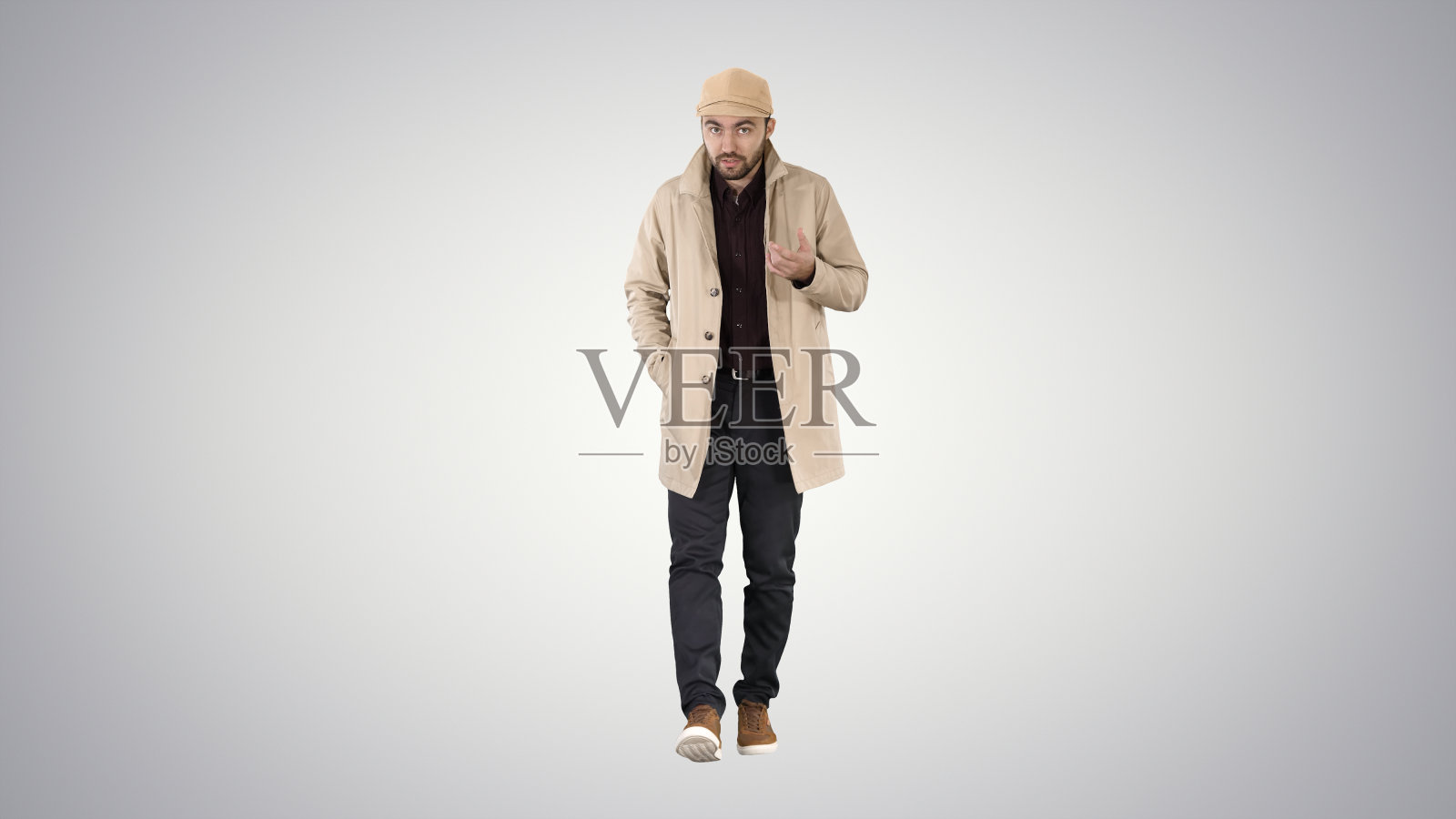 谈论年轻人在风衣自信地与相机J照片摄影图片