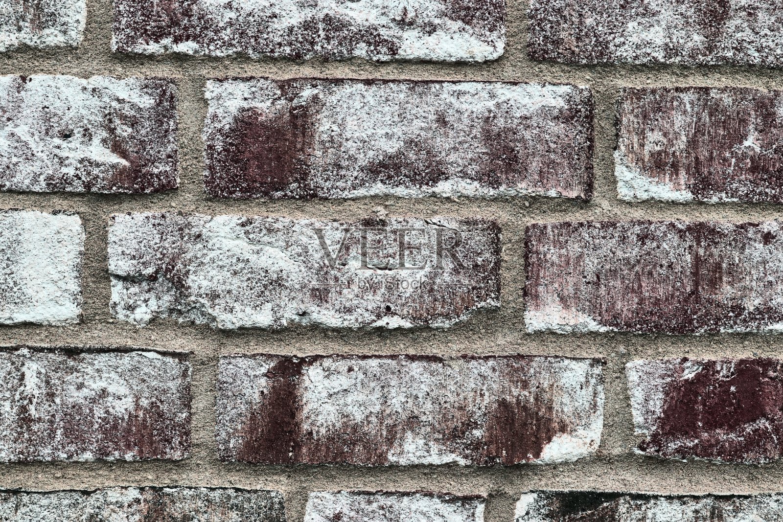以色彩丰富的老旧和饱经风霜的砖墙纹理作为全景背景。照片摄影图片