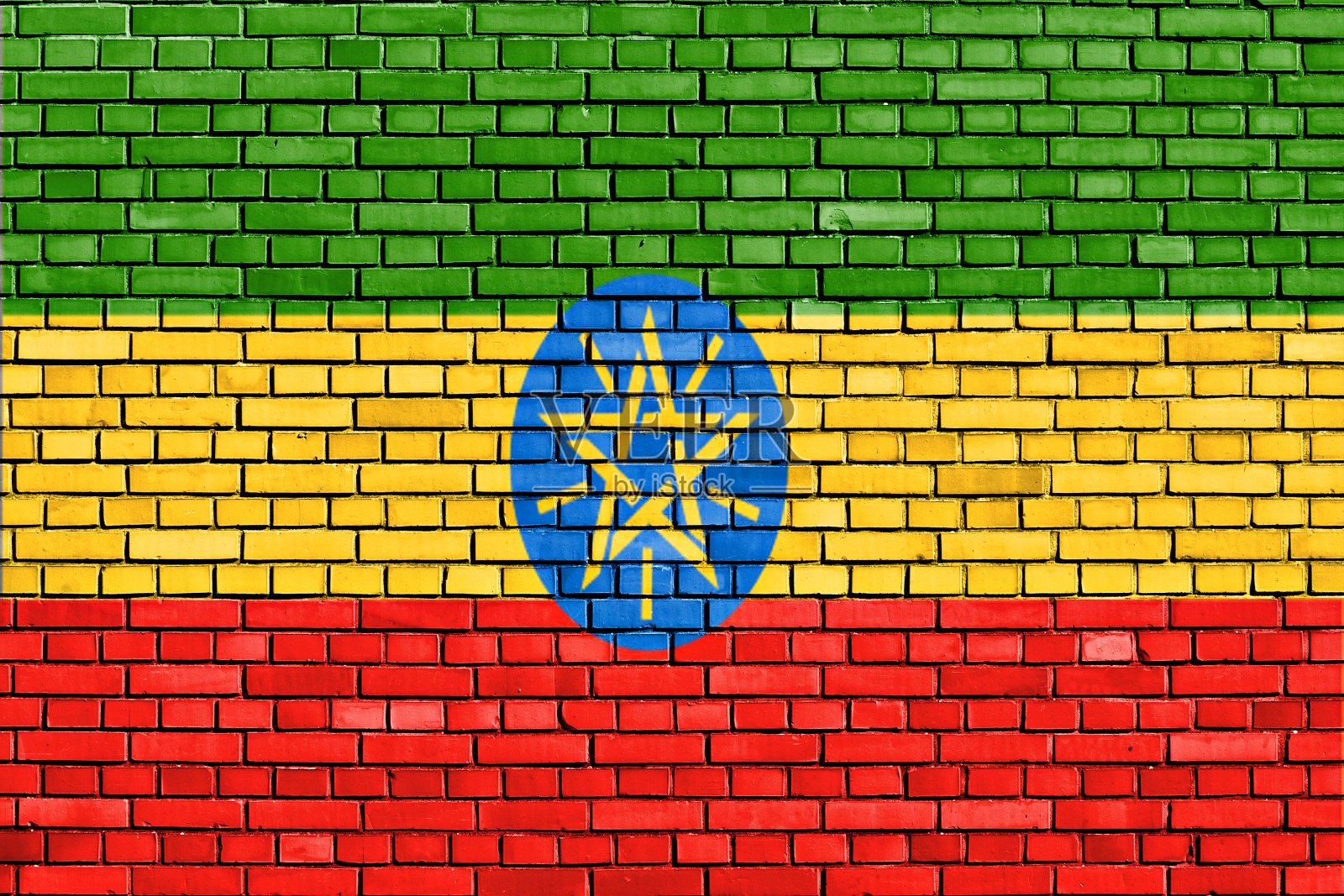 一面埃塞俄比亚国旗被画在砖墙上照片摄影图片