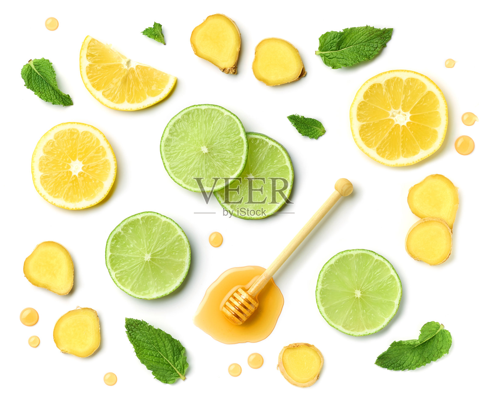 由蜂蜜匙、生姜片和柑橘片组成照片摄影图片