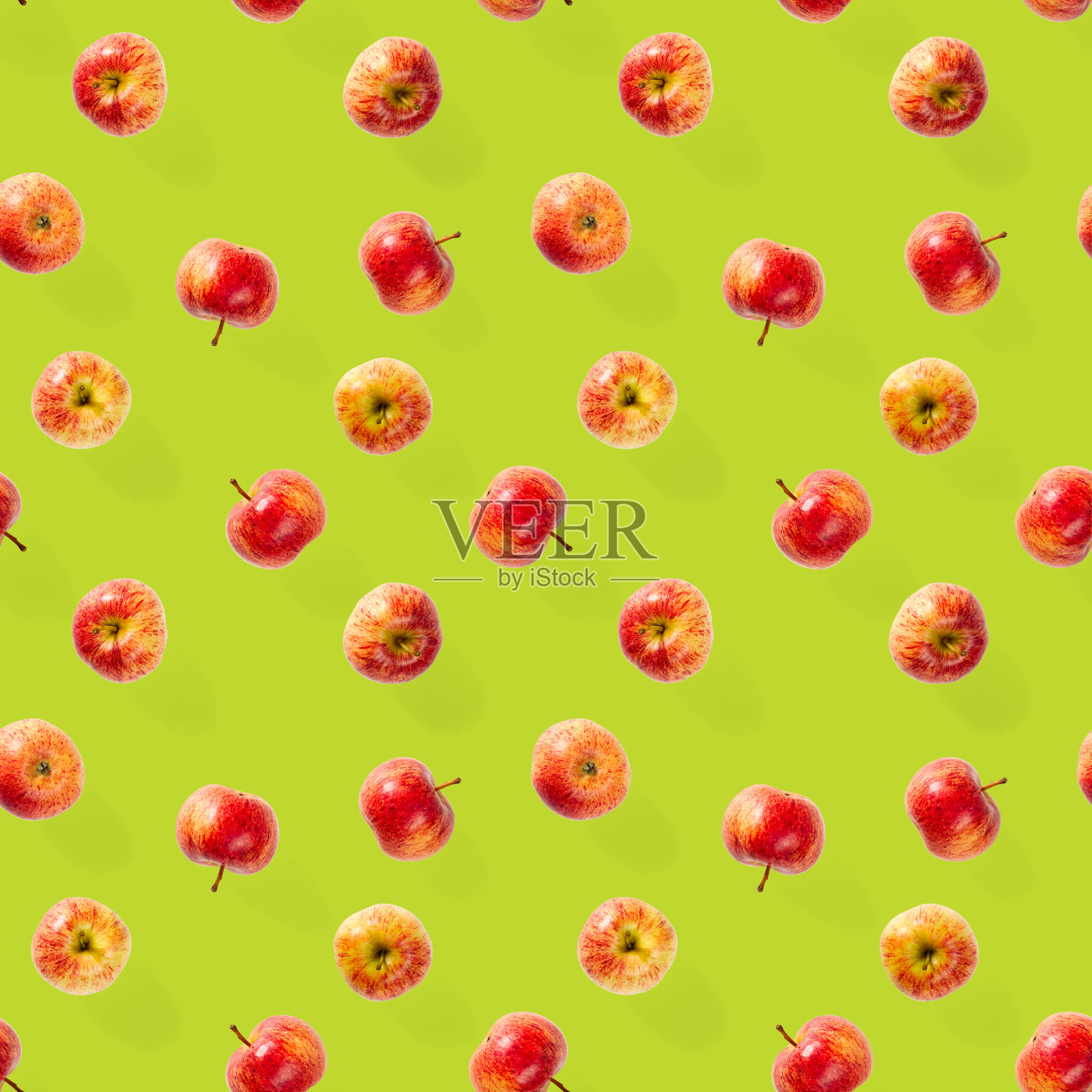 无缝模式与成熟的苹果。热带水果抽象背景。苹果无缝图案上的绿色背景。照片摄影图片