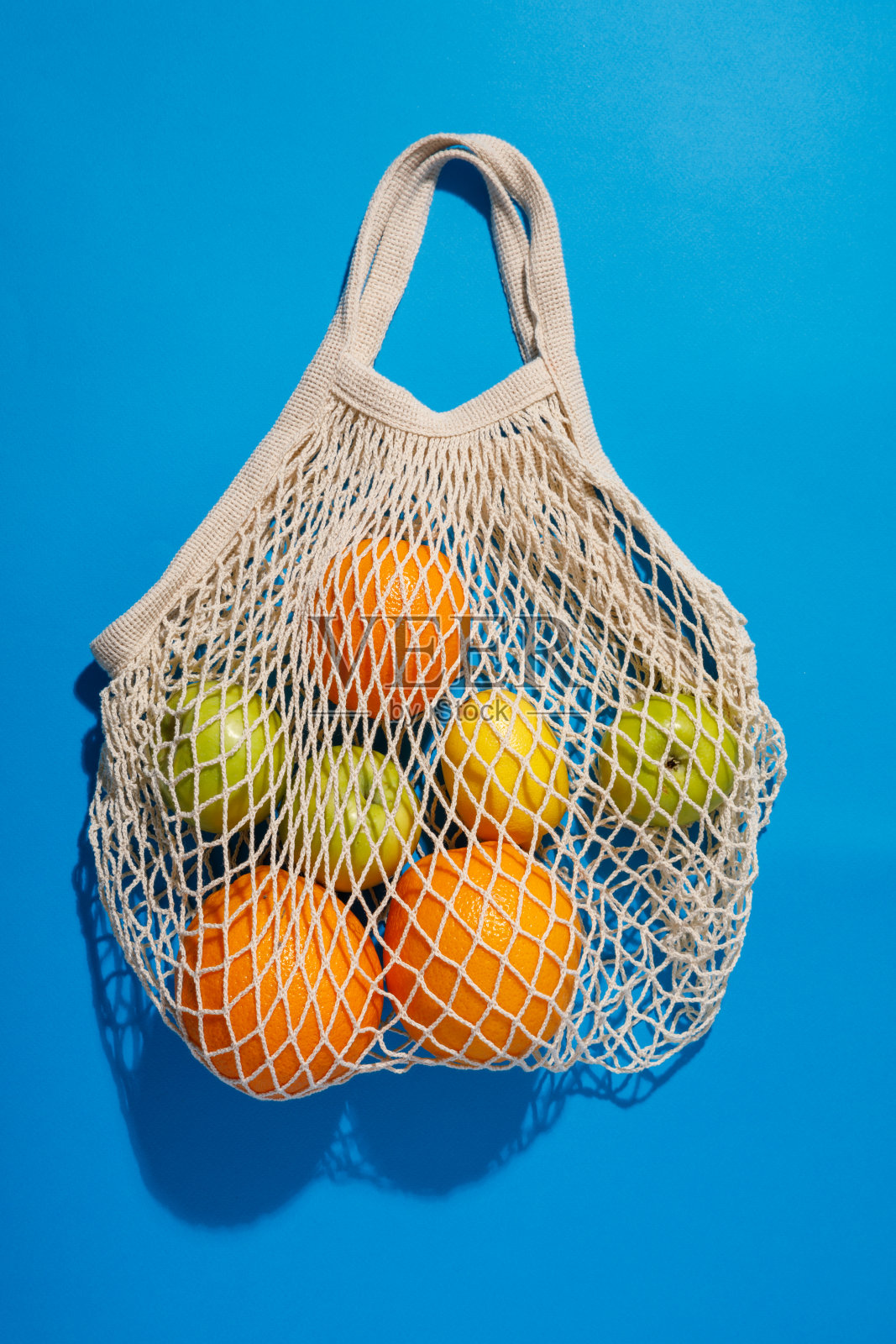 平网购物袋的蓝色背景照片摄影图片