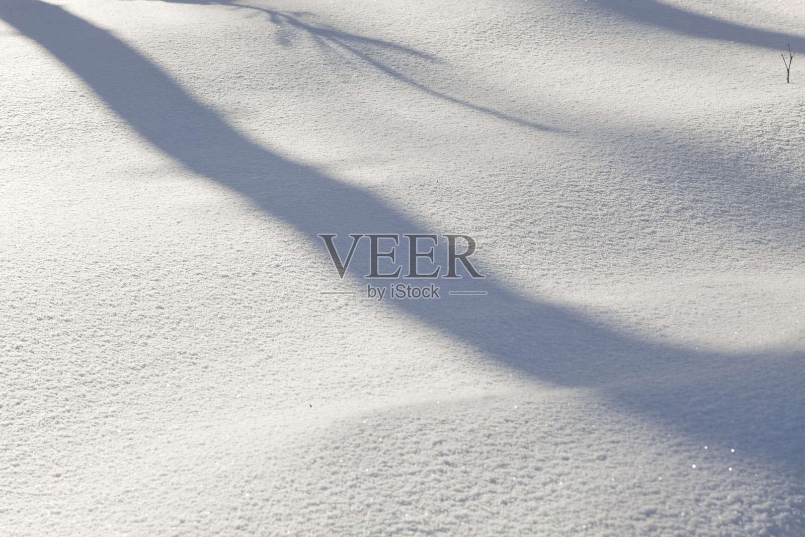带有光线和阴影的雪纹理照片摄影图片