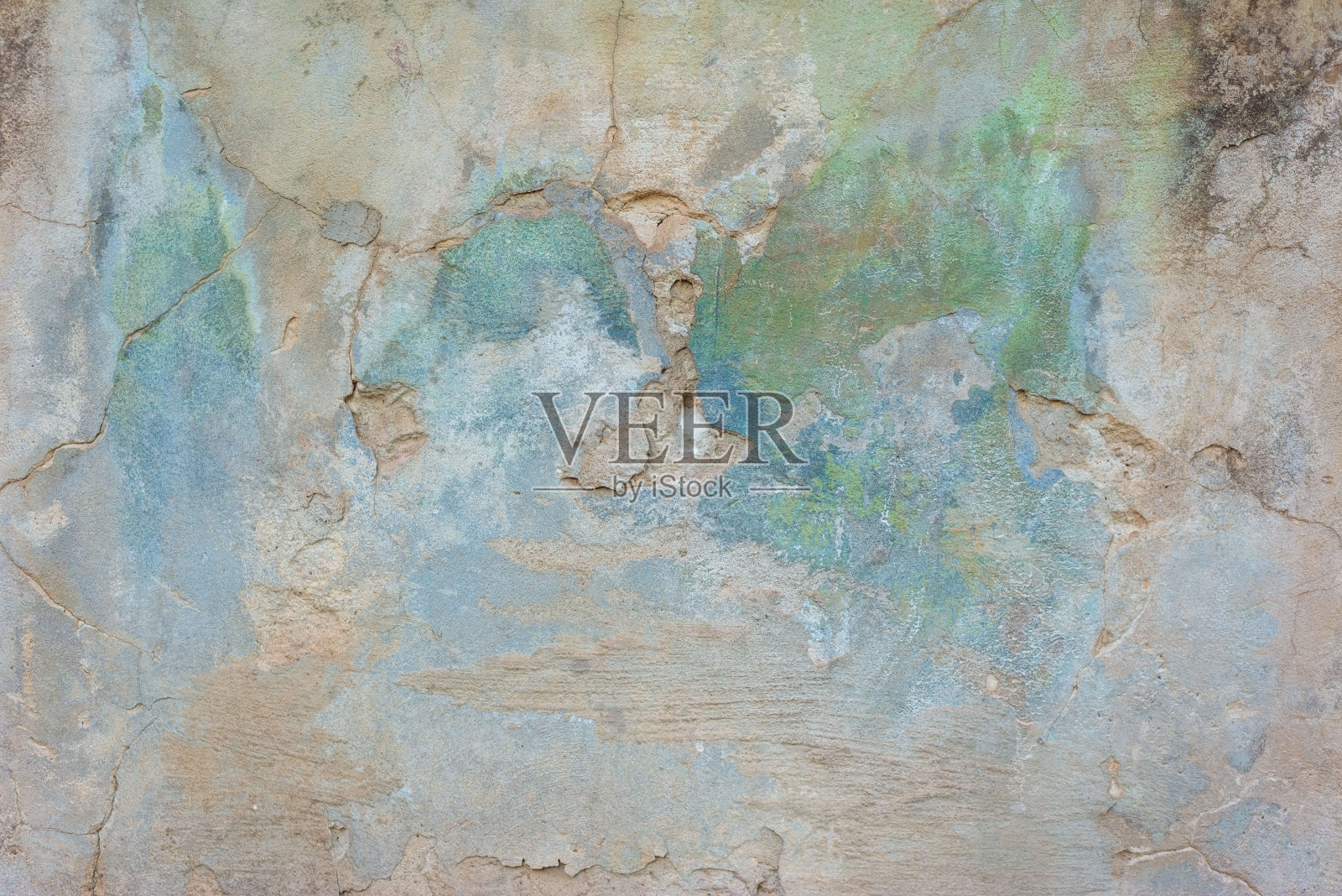 一幢临街房屋墙上的绿色旧灰泥纹理照片摄影图片