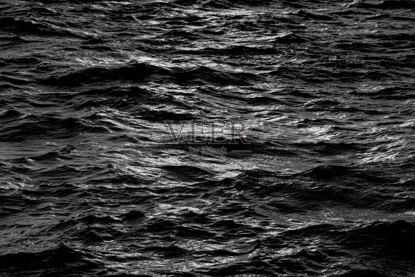 暗海水表面背景。照片摄影图片