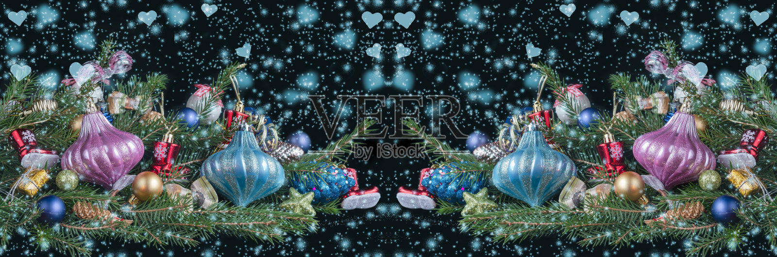 旗帜上装饰着杉树枝,飘落的雪花和蓝色的心状散科。圣诞节的概念照片摄影图片