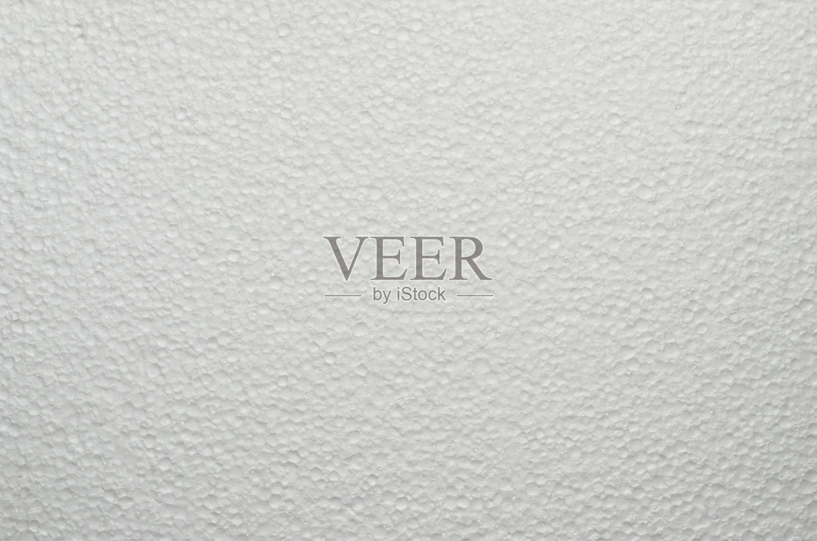 在运输过程中用于包装易碎物品的一片泡沫的质地。照片摄影图片