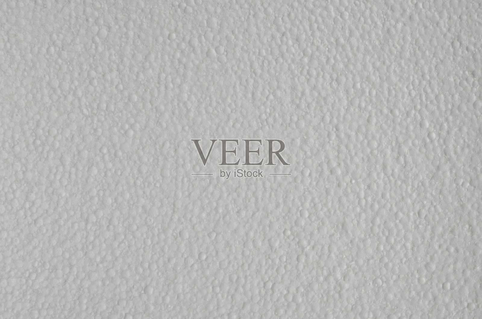 在运输过程中用于包装易碎物品的一片泡沫的质地。照片摄影图片