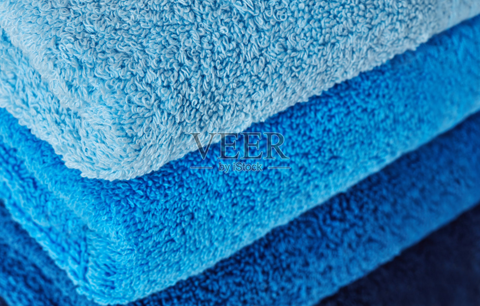 折叠的蓝色棉布毛巾照片摄影图片